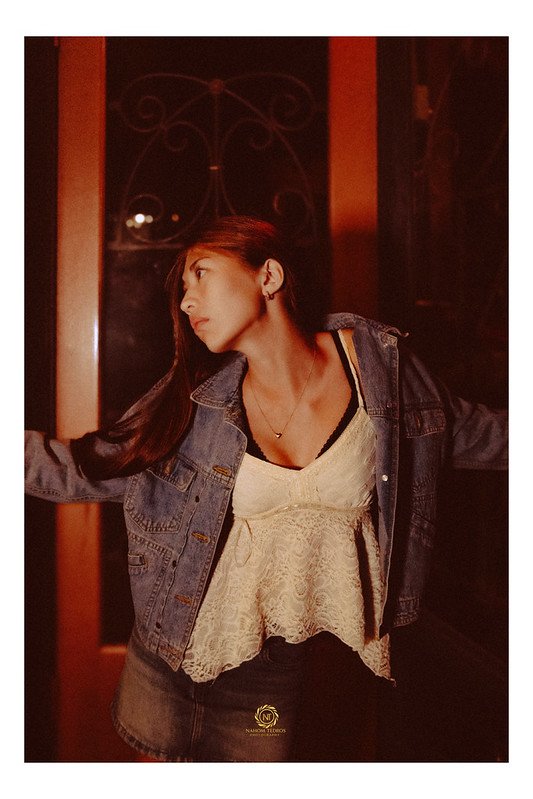 Portrait in denim and lace in warm interior light